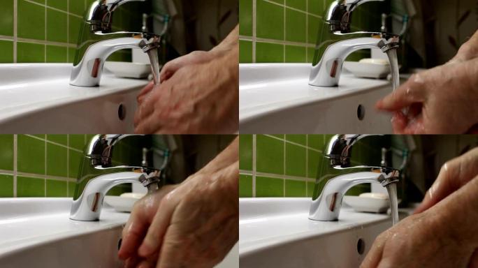 男子在盥洗台里洗手