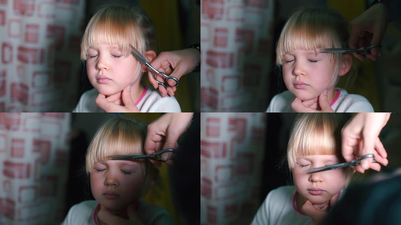 一个女孩在头上剪头发的特写镜头。