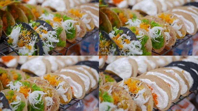 泰国脆皮煎饼或卡农布昂-美味的泰国街头甜点，在夜市很受欢迎。特写