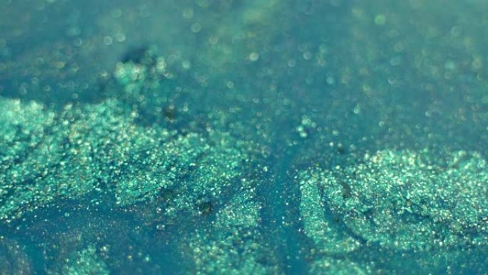 薄荷蓝绿色珍珠液体闪光纹理微距