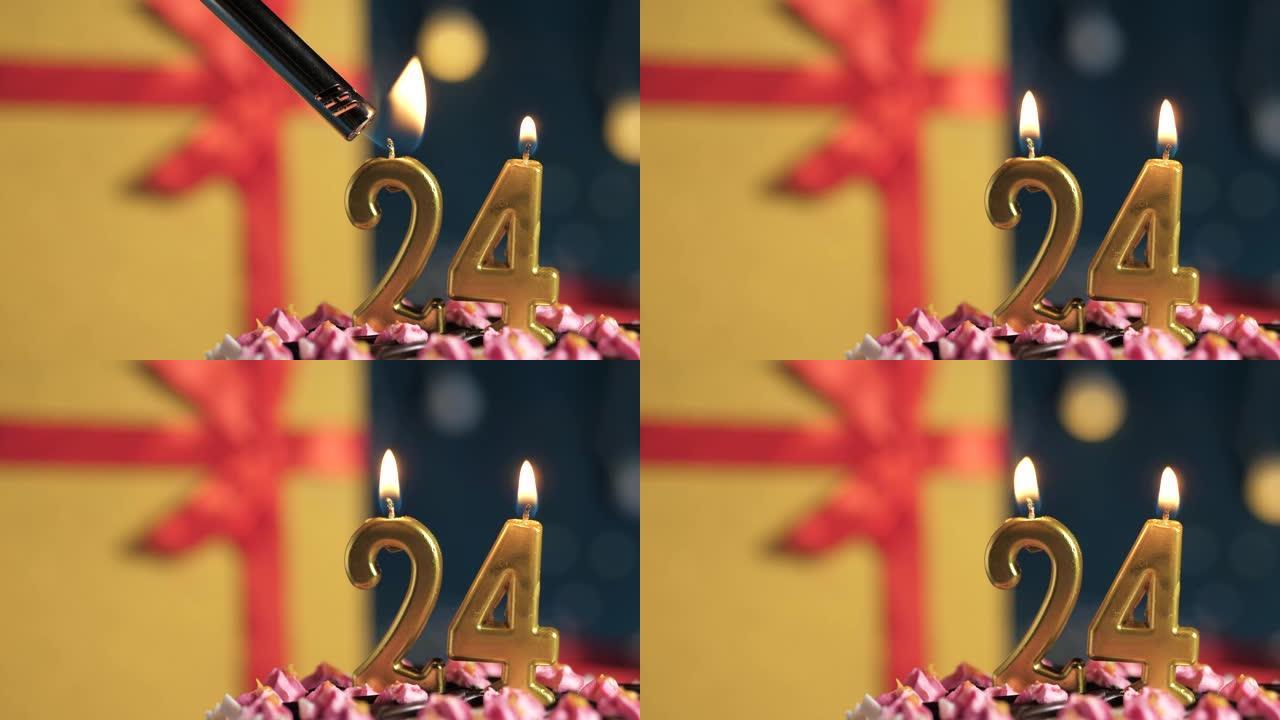 生日蛋糕编号24点灯燃烧的金色蜡烛，蓝色背景礼物黄色盒子用红丝带绑起来。特写和慢动作