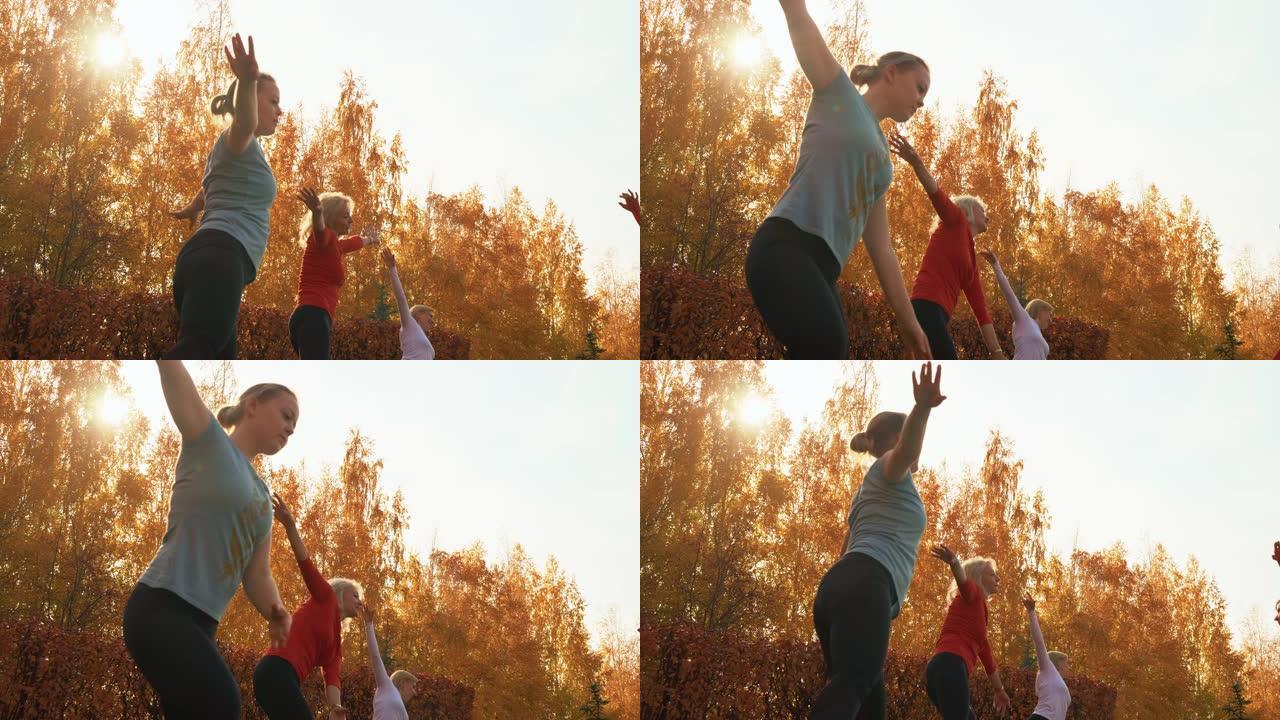 秋季公园户外课体育女训练编舞。女子舞蹈团在城市公园训练舞蹈练习。练习胸罩港的健身女子。