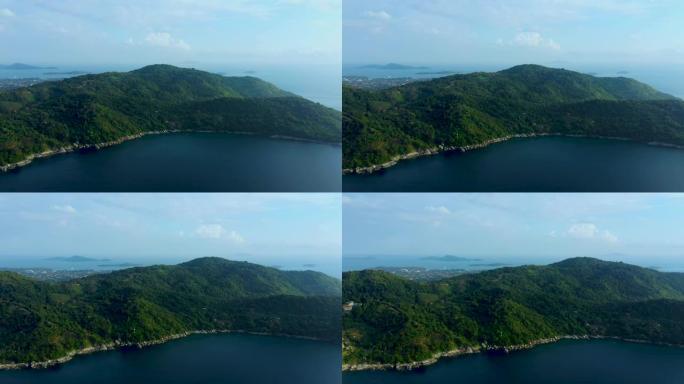 热带度假胜地和海滩的空中全景，普吉岛西海岸美丽的安达曼海。卡塔诺伊海滩从上面，一些建筑和绿色的山丘，