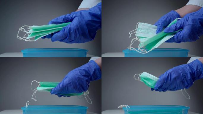 医生或护士从塑料容器中取出呼吸面罩。用医用手套保护的手。大流行保险冠状病毒，新型冠状病毒肺炎，传染性