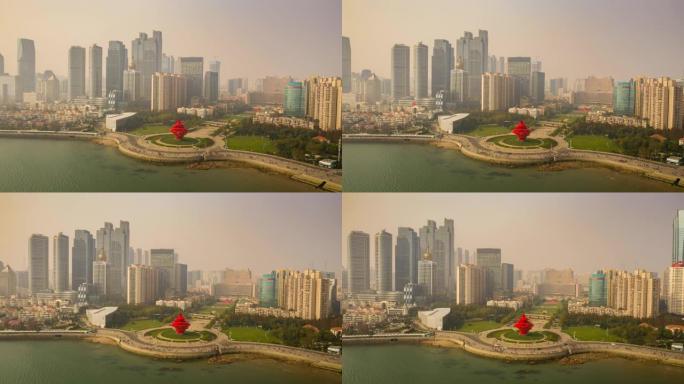 晴天飞行在青岛市著名海湾纪念碑广场空中延时全景4k中国