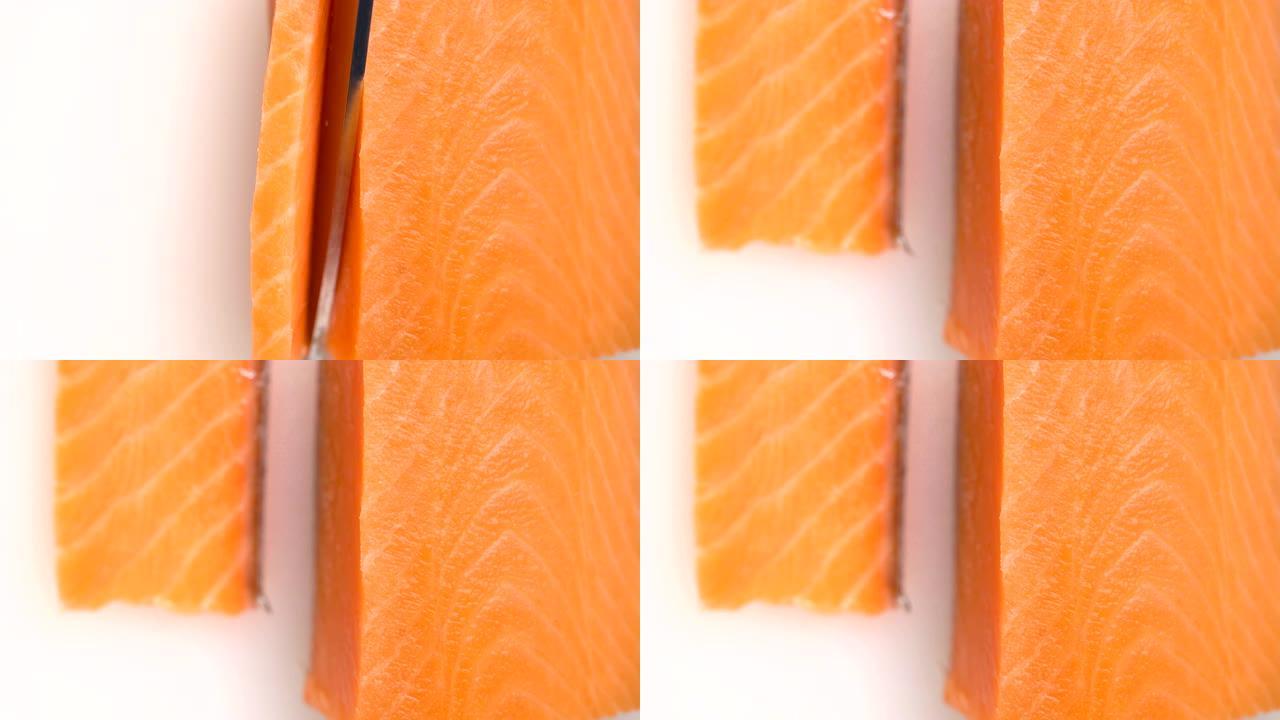 宏观厨师切鲑鱼片，用于烹饪寿司特写。