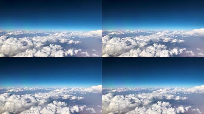 旅行时从窗口飞机看空中天空和云景