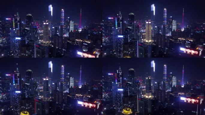 夜间照明广州城市景观市中心空中全景倾斜移动4k中国