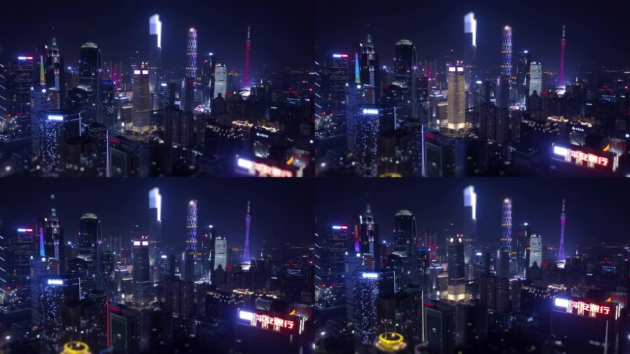 夜间照明广州城市景观市中心空中全景倾斜移动4k中国