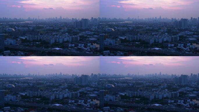 在黄昏或夜间从建筑物顶部观看曼谷景观的4k镜头