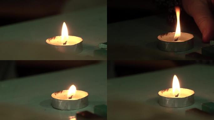 一根小蜡烛在桌子上燃烧