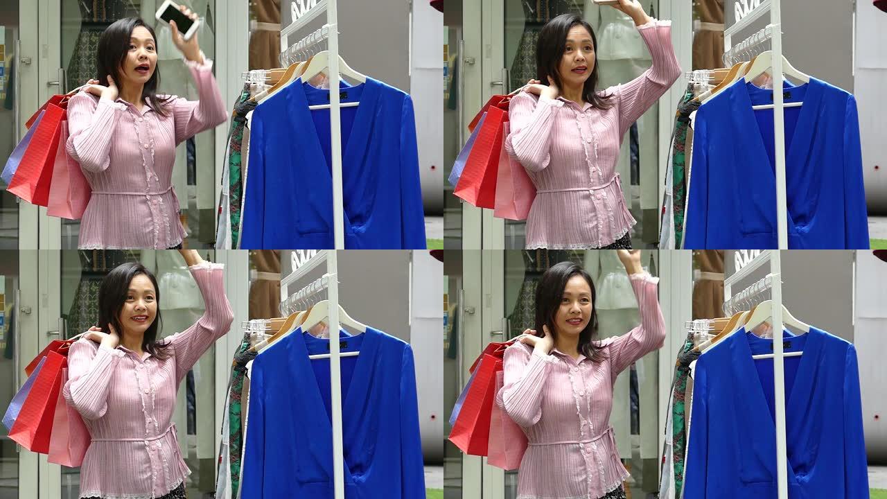 亚洲女性在服装店购物服装