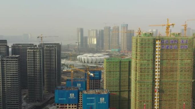 阳光明媚的杭州城市景观著名的奥林匹克体育场综合体巨型建筑场空中全景4k中国