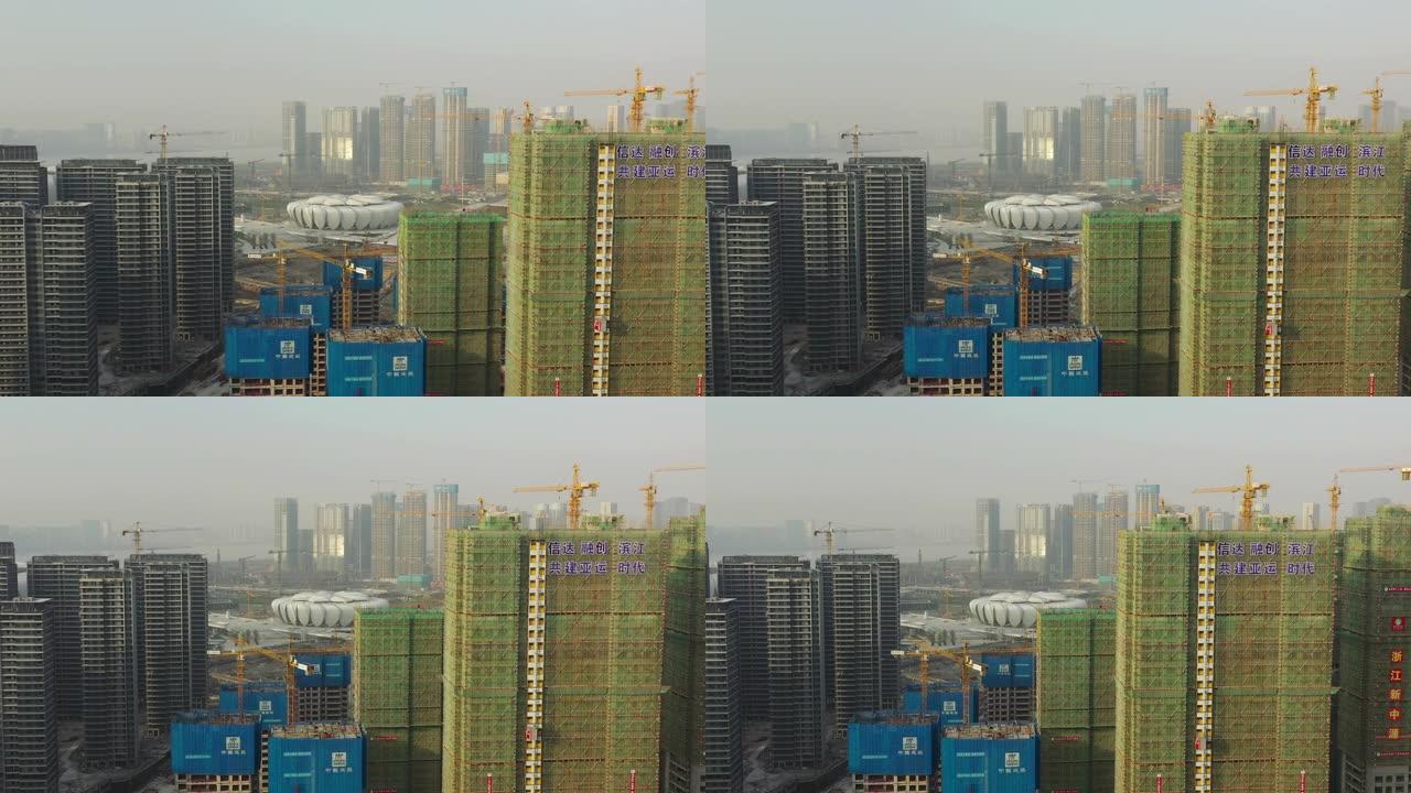阳光明媚的杭州城市景观著名的奥林匹克体育场综合体巨型建筑场空中全景4k中国