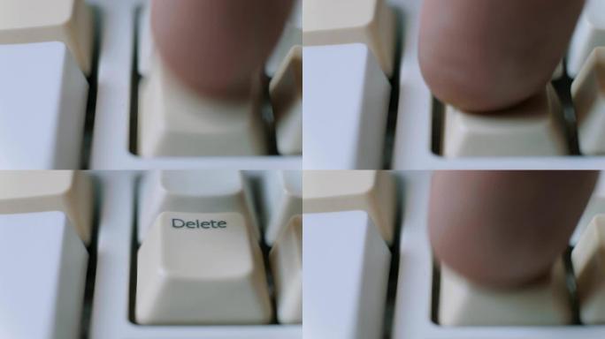 人类手指的特写镜头反复按下键盘上的删除键。