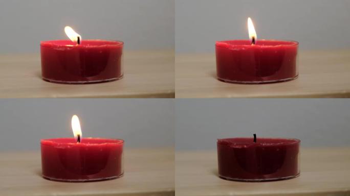 黑暗房间里美丽的蜡烛火。特写。