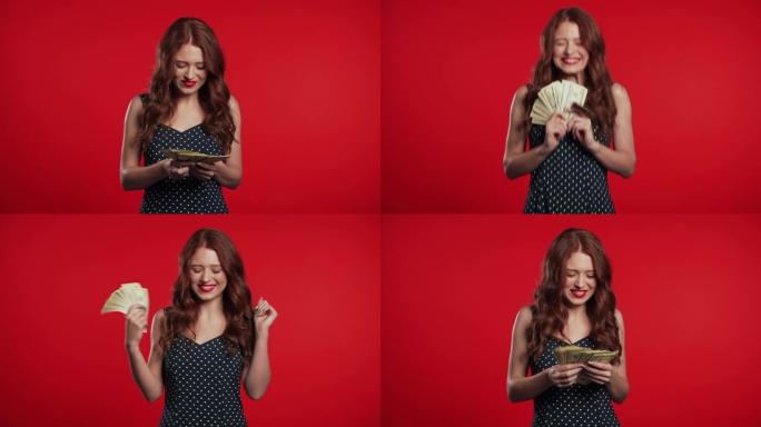 满意的快乐兴奋的女孩显示钱-红墙上的美国货币美元钞票。成功、收获、胜利的象征。