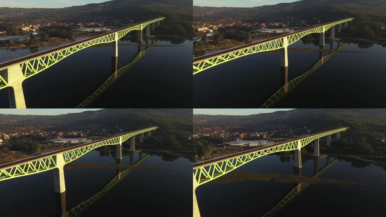 通过日落光从无人机拍摄的过河桥俯视图