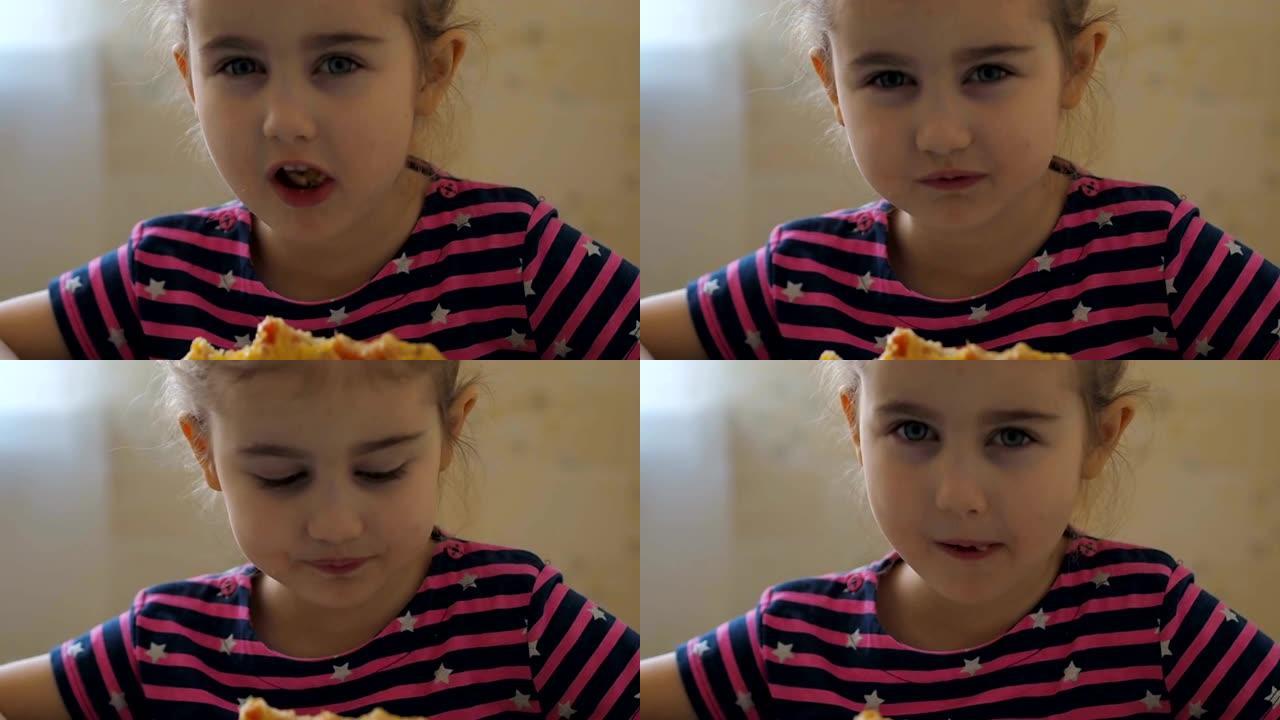 可爱的高加索小女孩吃披萨。饥饿的孩子吃披萨。