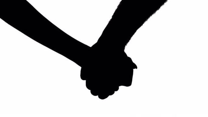 一对手牵手的夫妇的剪影。爱情概念。黑白