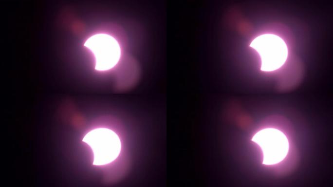 太阳日食概念，白天2019年12月日食上的运动强光，就像望远镜相机上的眼镜看太阳一样