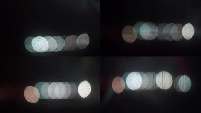由运动中发光灯泡的散景效果制成的纹理。