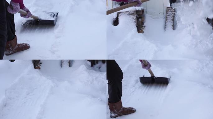 用铲子除雪。一个女人用铲子从积雪中清理一条小路