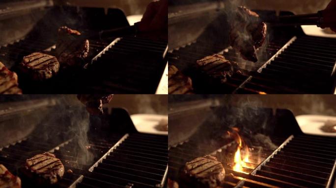 晚上，户外用钳子在烤架上拿起热的，油腻的，滴水的，调味的无骨里脊肉排骨