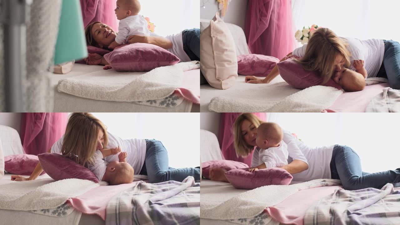 母亲和她的女婴在床上拥抱的照片