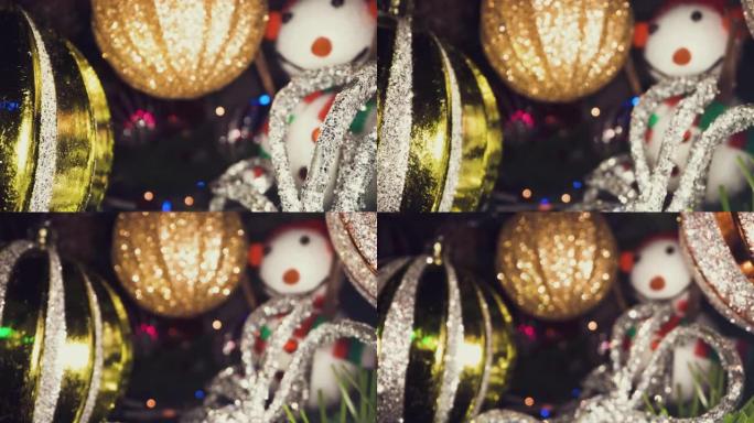 特写镜头多莉在圣诞树上发光闪闪发光的彩色球