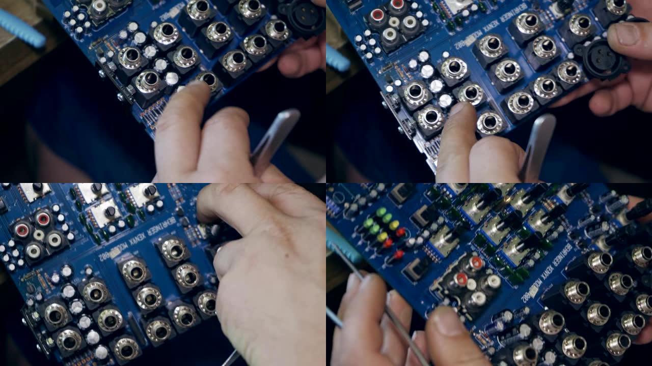 修理工修理音频混合器的一块板