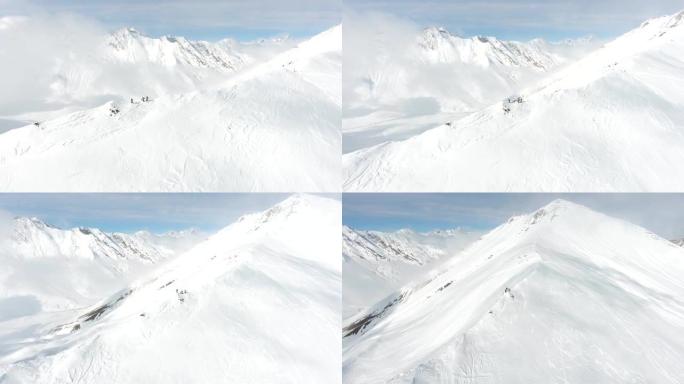 山顶上的一群极端滑雪者。滑雪道斜坡上的自由行。俯视图。佐治亚州高加索山脉，滑雪胜地古达里。