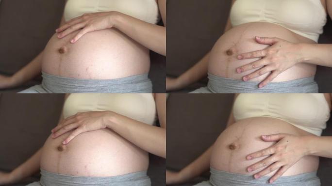 孕妇摸着肚子孕妇抚摸肚子母性光辉