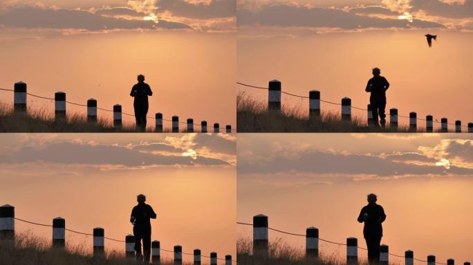 前视图亚洲老年人锻炼。早上在慢动作后面的日出上跑步的高级男子。健康生活方式和运动理念