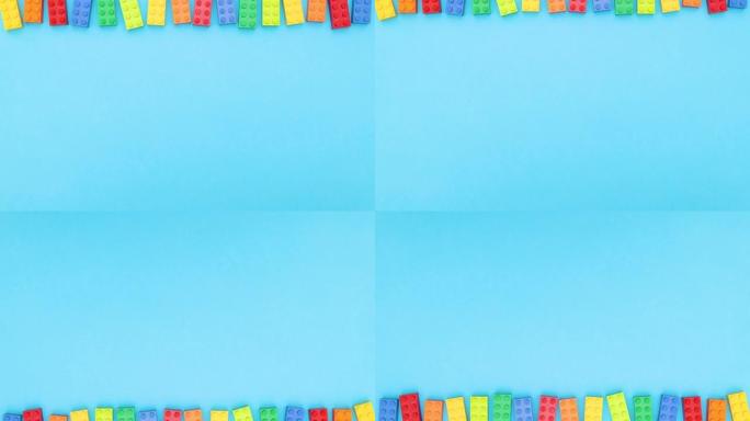 彩色砖块在蓝色背景的顶部和底部上下移动-停止运动