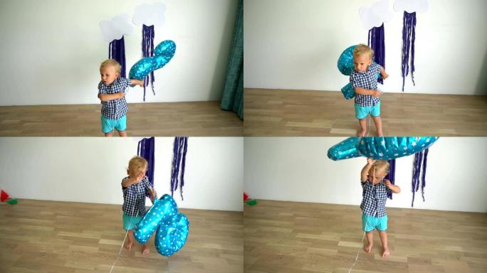 两岁男孩玩气球。万向节运动