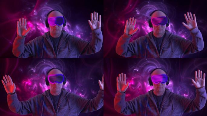英俊的男人在霓虹灯背景下用虚拟现实眼镜观看视频。vr护目镜中的成年男子在网络空间中摇曳双手。VR技术
