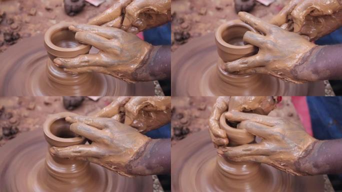 陶工制作陶器的手和手指姿势最终出错