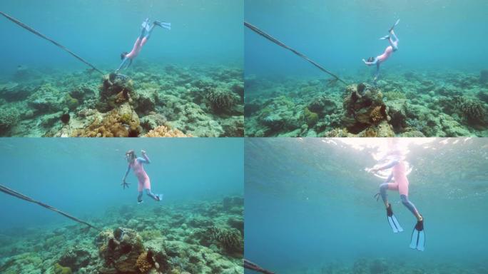 一个儿童自由潜水者在水下采摘海星。