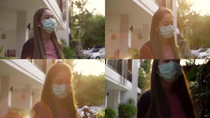 戴着面具走路上班的亚洲女人。