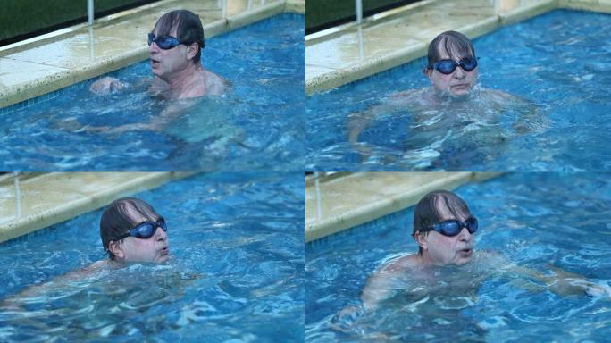 老人在游泳池旁游泳，抱着游泳池边深呼吸