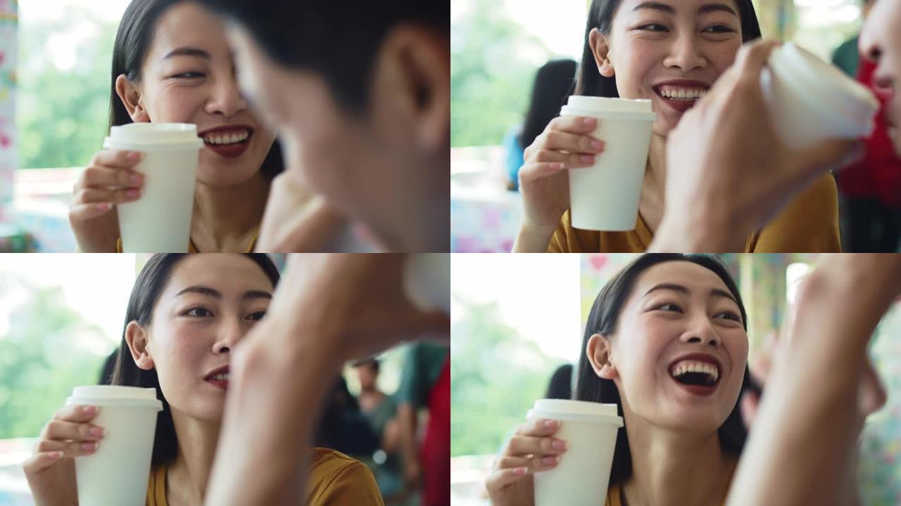 越南夫妇在咖啡馆喝咖啡的手持视图