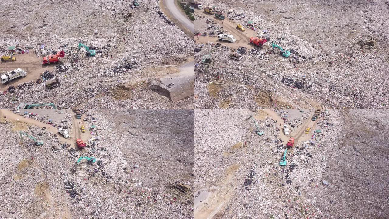 废物处理露天垃圾场的鸟瞰图。在垃圾填埋场工作的机器。