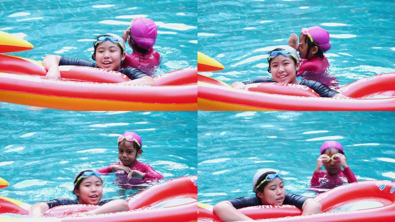泰国CHON BURI-2019年10月20日: 暑假亚洲家庭旅游度假派对在度假村的游泳池小女孩和男