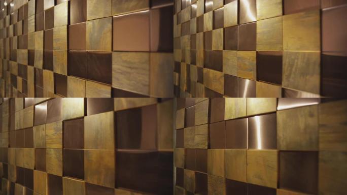 4k金色或铜方形背景。抽象3D金色金属立方体。墙壁用金、铜或金属砖、盒子。在红龙电影摄像机上拍摄。