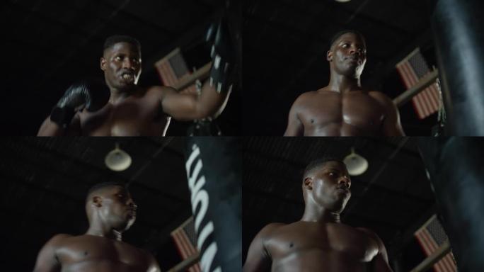 光着膀子的非裔美国人在MMA健身房完成了沉重的背包