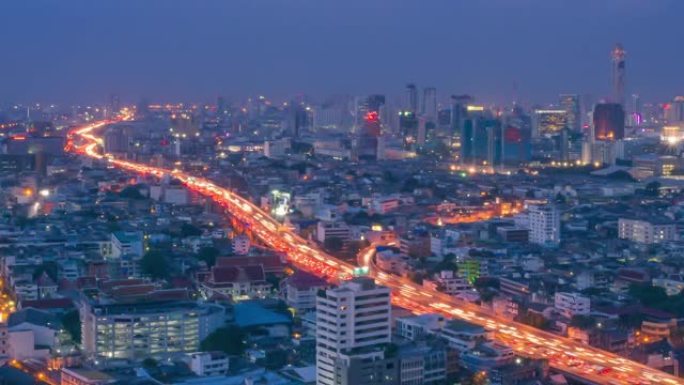 延时视频4k分辨率，泰国曼谷商业区高峰时段的黄昏交通。曼谷市中心晚上的城市景观。带噪音的软聚焦。