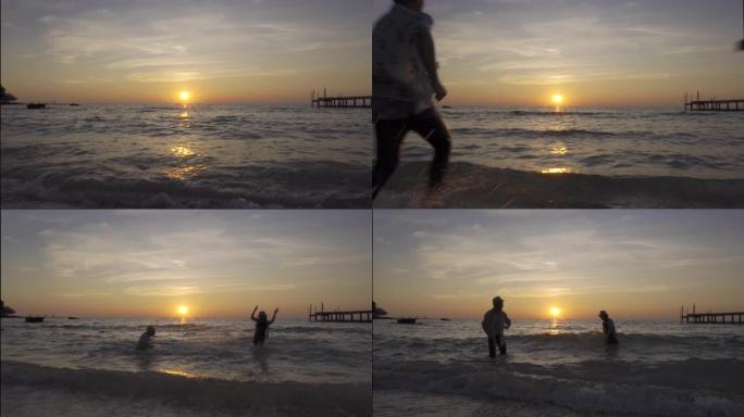 快乐快乐的亚洲夫妇一起跑向大海，日落时在热带海滩上泼水 -- 关于浪漫度假、蜜月的概念。