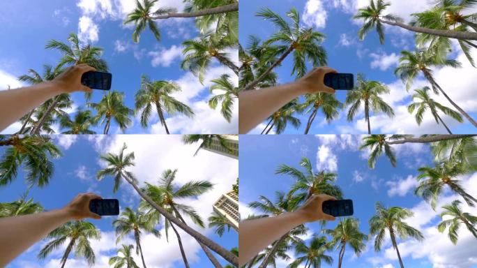 以4k慢动作60fps拍摄檀香山夏威夷岛棕榈树的游客视点