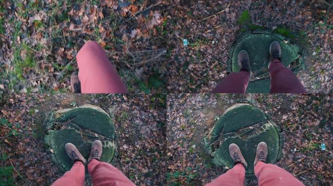 走过森林的旅行者的脚的特写镜头。